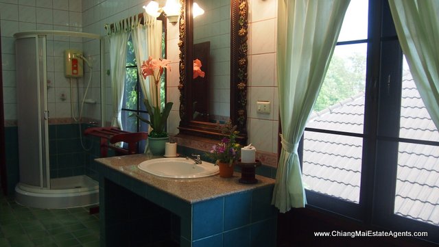 Traditional Lanna Style Home in Modern Moo Baan